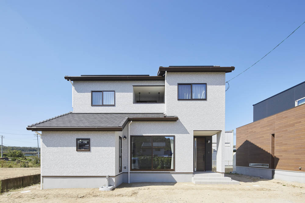 庭へのアプローチを楽しむ家